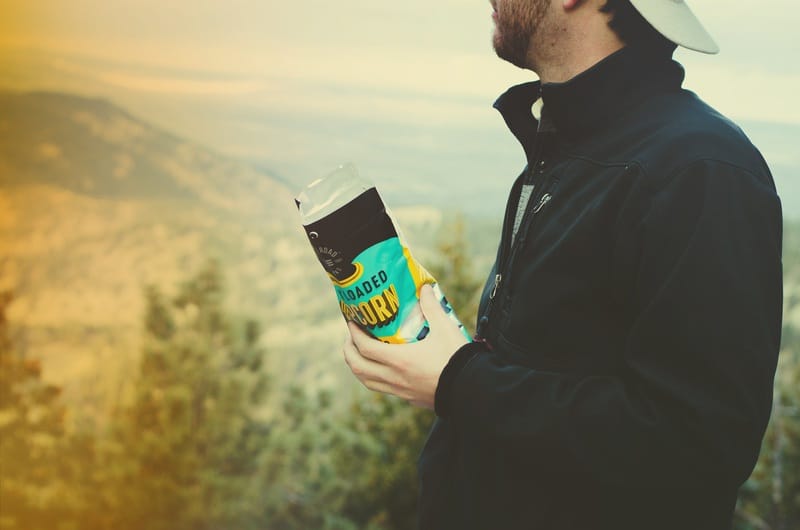 Man outside eating Open Road popcrn